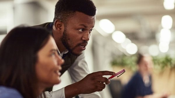 Shot of two businesspeople working together in an office