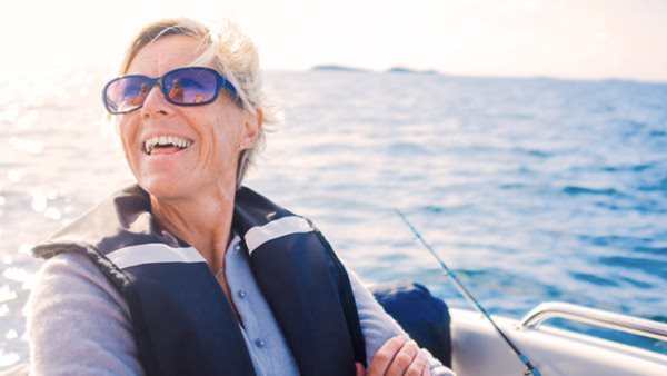 A woman enjoys an afternoon of sailing